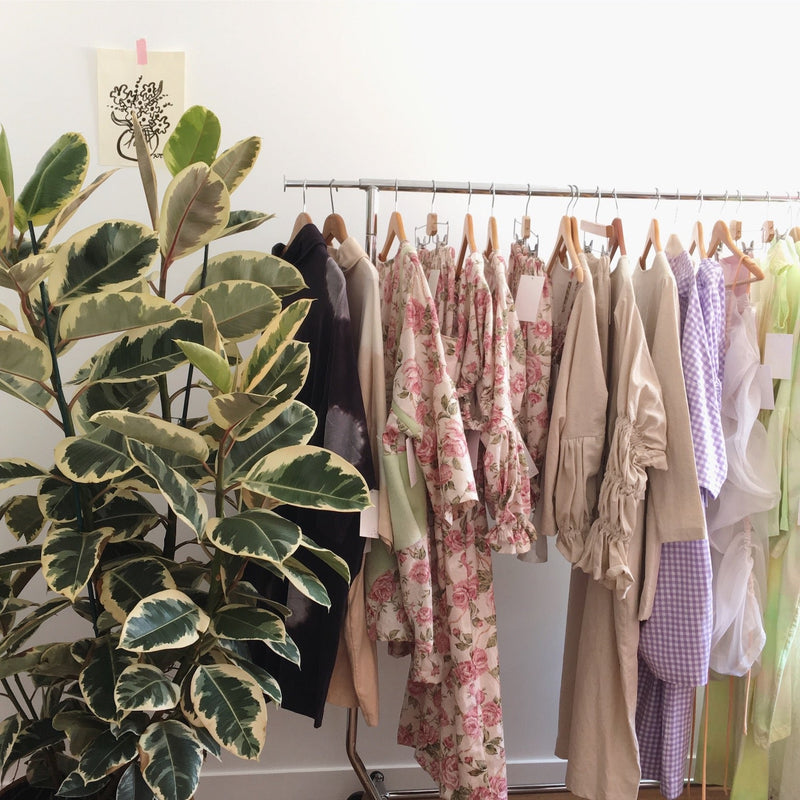 Rack of clothing by brand 323