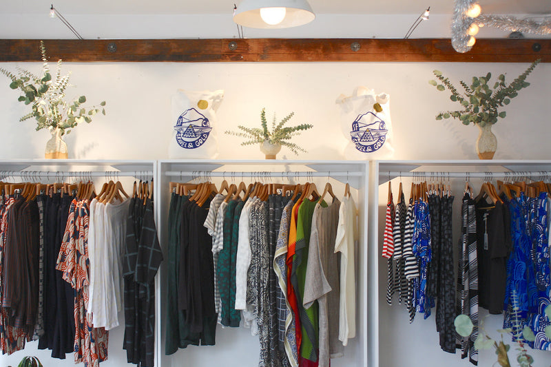 Racks of clothing by Gravel and Gold
