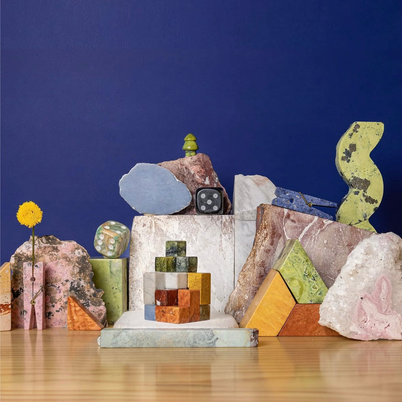 Assortment of stones and stone decorative objects