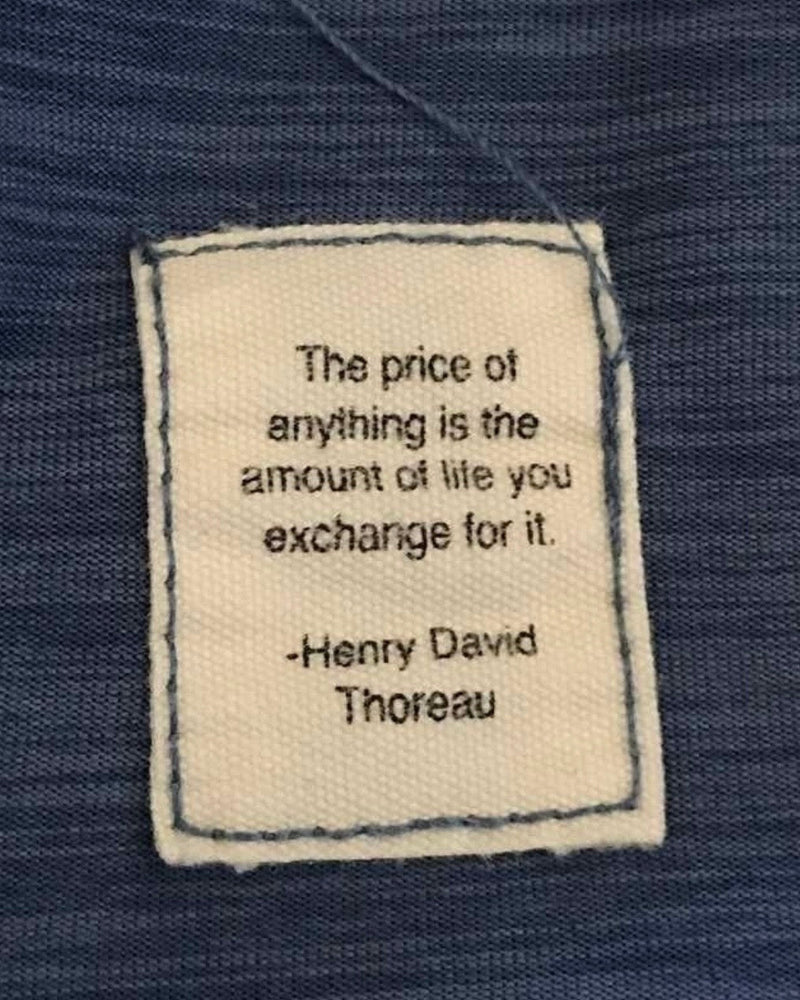 Quote by Henry David Thoreau "The price of anything is the amount of life you exchange for it" sewn on a patch of fabric