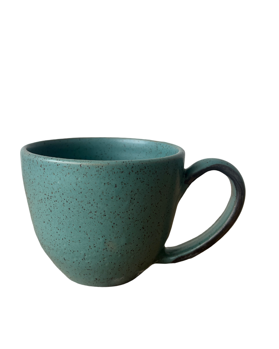Speckled teal mug on a white background