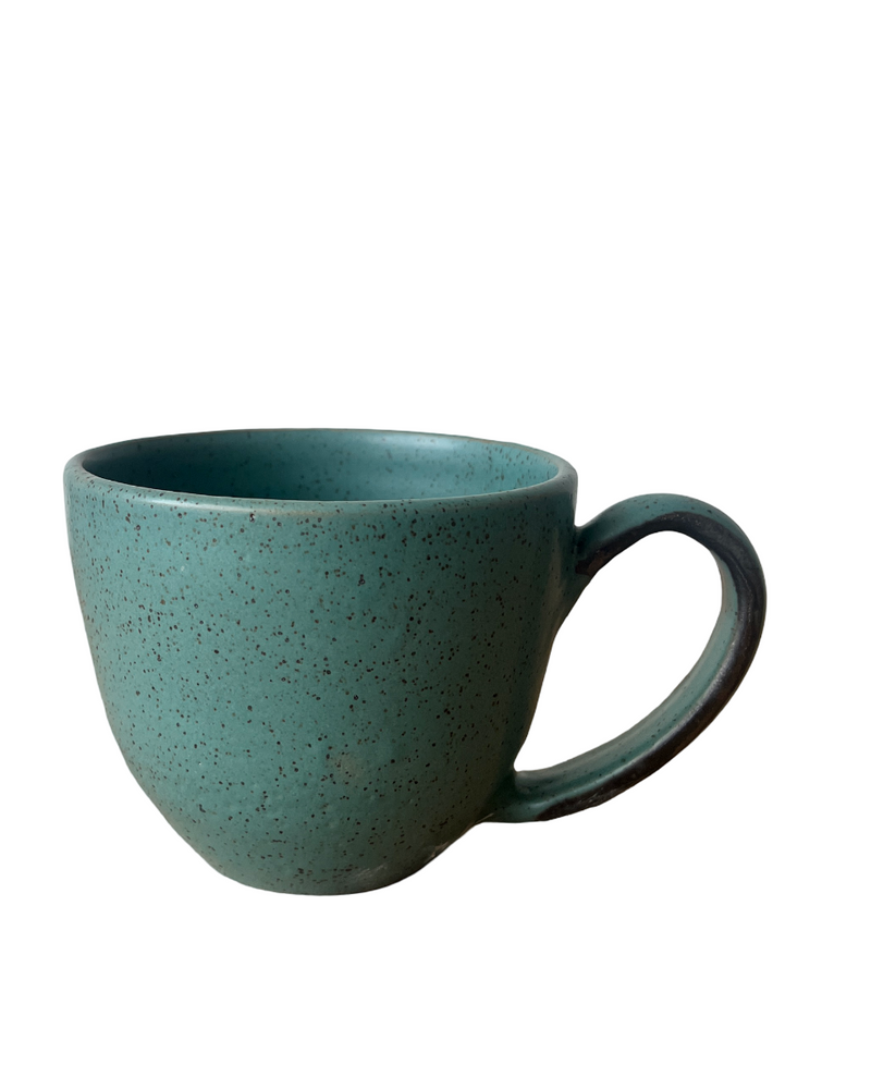 Speckled teal mug on a white background