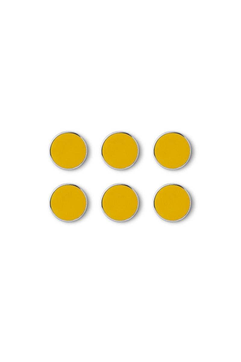 Six yellow circular magnets on a white background