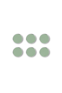 Set of six green circular magnets on a white background