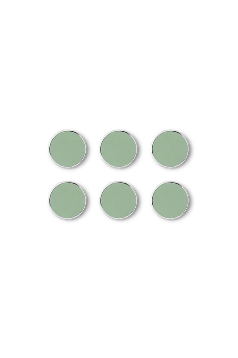 Set of six green circular magnets on a white background