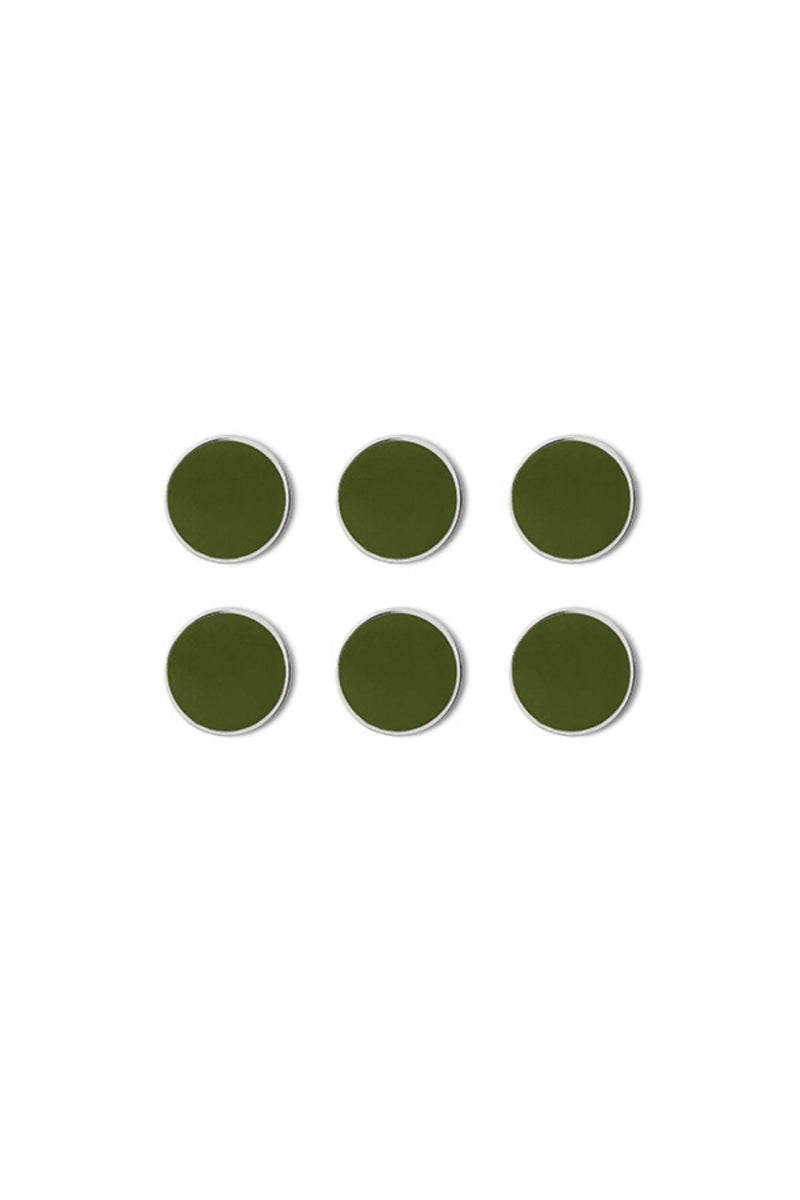 Six green circular magnets on a white background