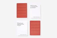 Two red prompt cards with geometric patterns on a white background