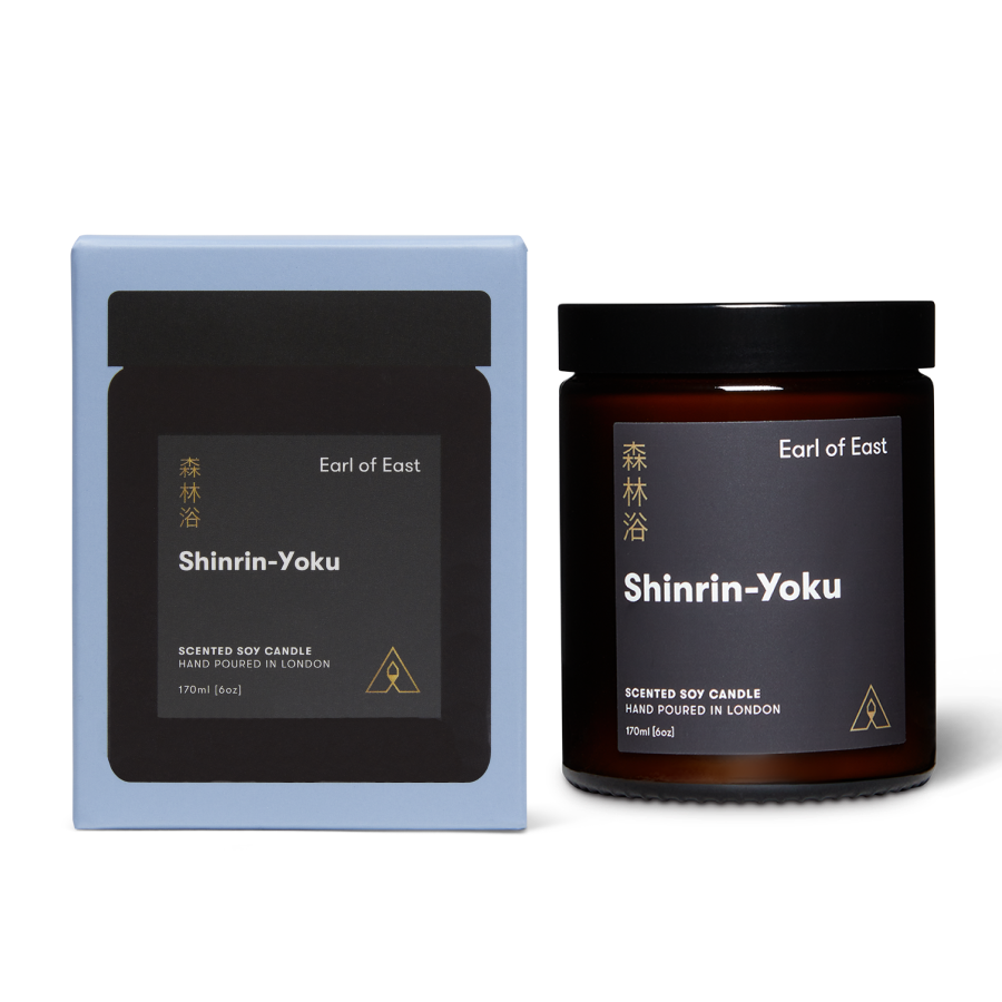 Jar scented soy candle with branded label next to a branded box reading Earl of East Shinrin-Yoku