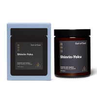 Jar scented soy candle with branded label next to a branded box reading Earl of East Shinrin-Yoku