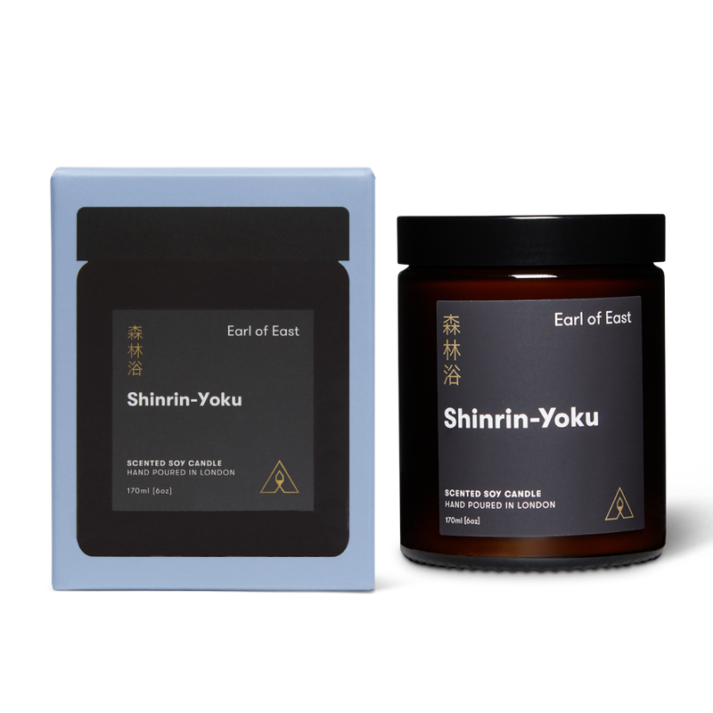 Jar scented soy candle with branded label next to a branded box reading Earl of East Shinrin-Yoku