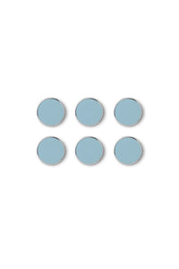 Set of six light blue circular magnets on a white background