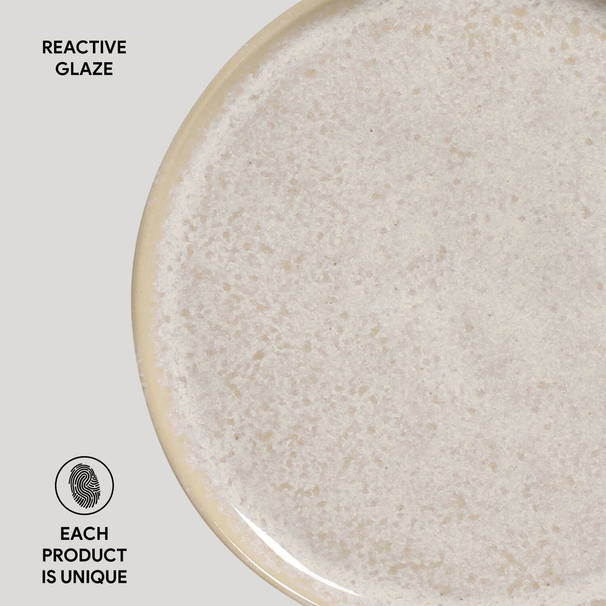 Close-up of a ceramic plate with reactive glaze texture on a light gray background