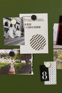 Collage of photos and stickers held by magnets on a green board background