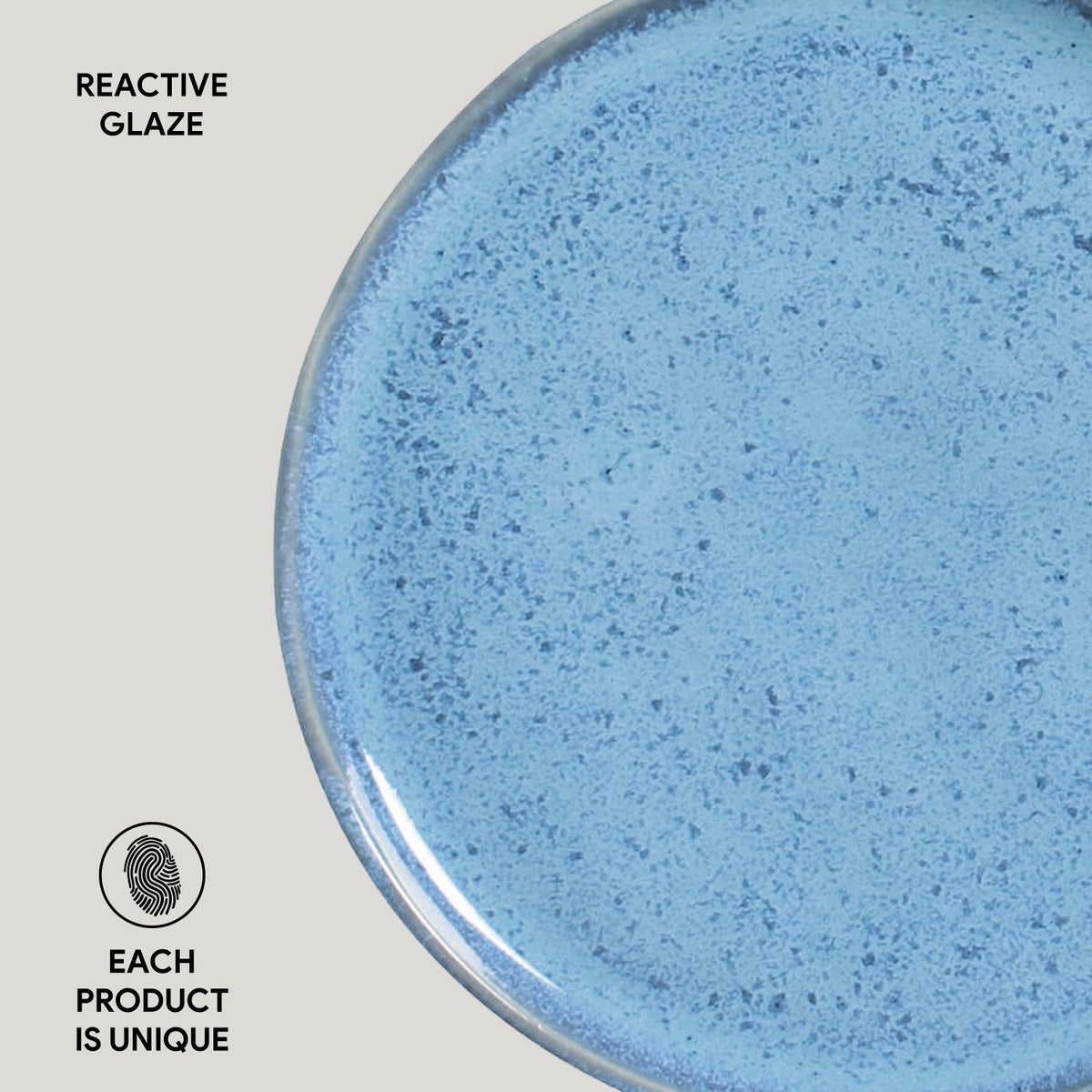 Close-up of a blue ceramic product with reactive glaze on a gray background