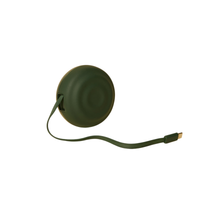 Green retractable charing cord on a white background