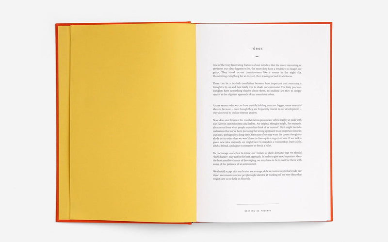 Open book with yellow pages and white text on a white background