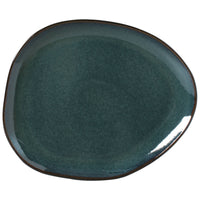 Deep teal ceramic plate on a white background