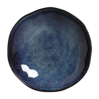 Blue ceramic bowl with a textured surface on a white background