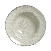 Speckled ceramic bowl on a white background