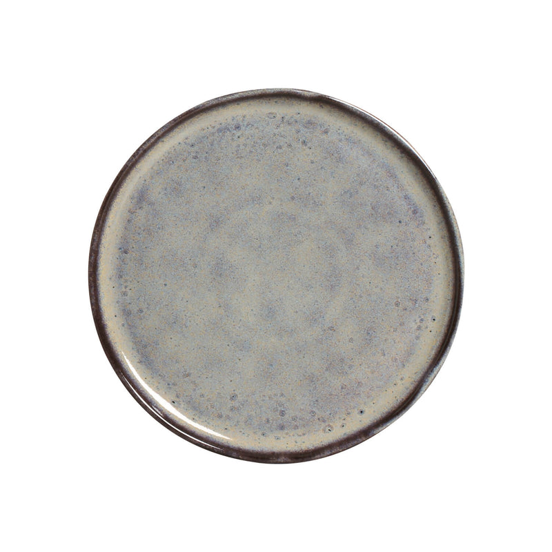 Round ceramic plate with a speckled design on a white background