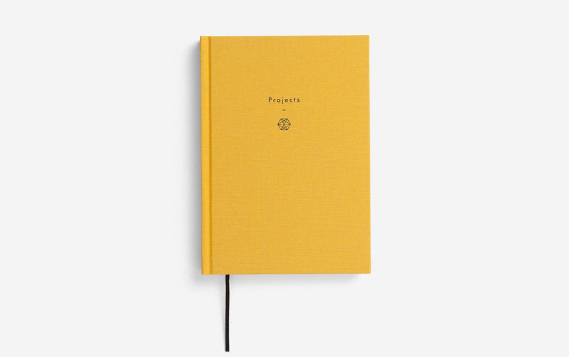 Yellow notebook with 'Projects' text on a white background