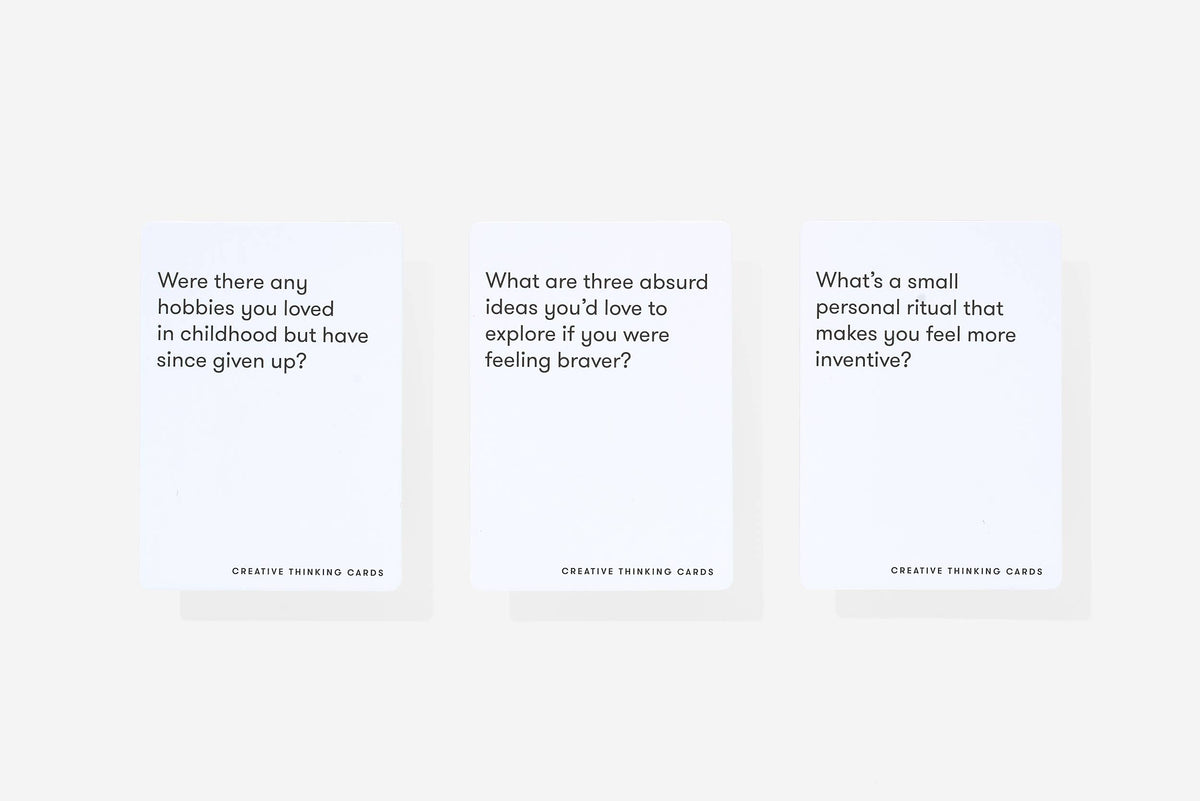 Three text prompt cards on a white background