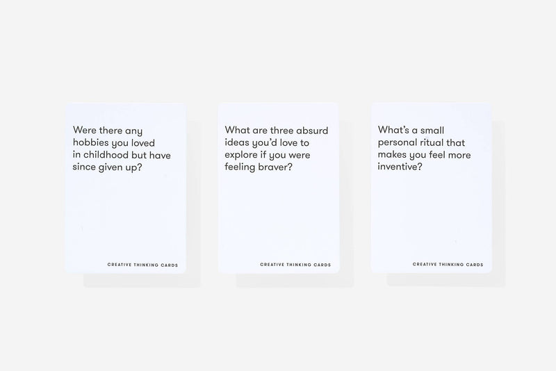 Three text prompt cards on a white background