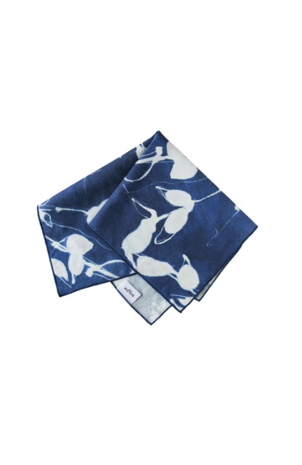 Blue and white patterned folded napkin on a white background