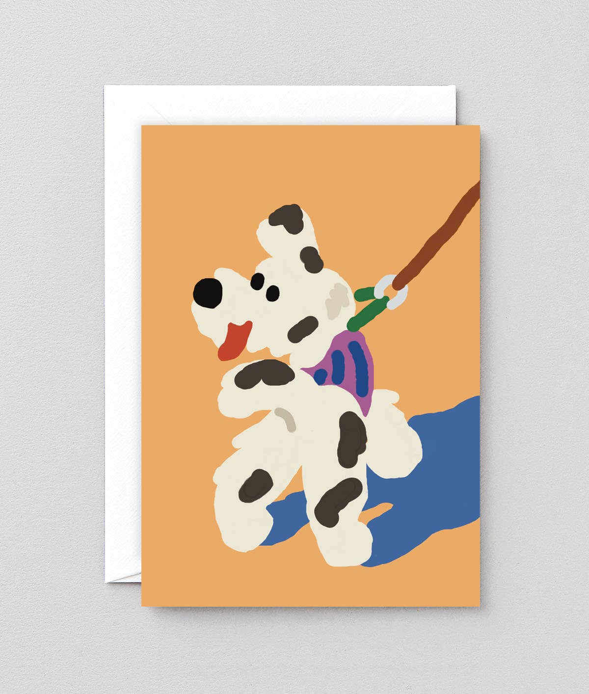 Greeting card with an illustrated dog on a leash against an orange background