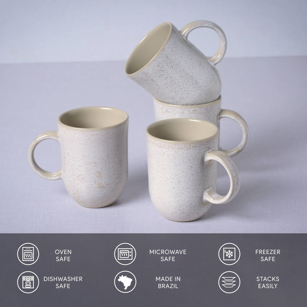 Set of four ceramic mugs with speckled finish on a light gray background, featuring icons and text about safety and features.