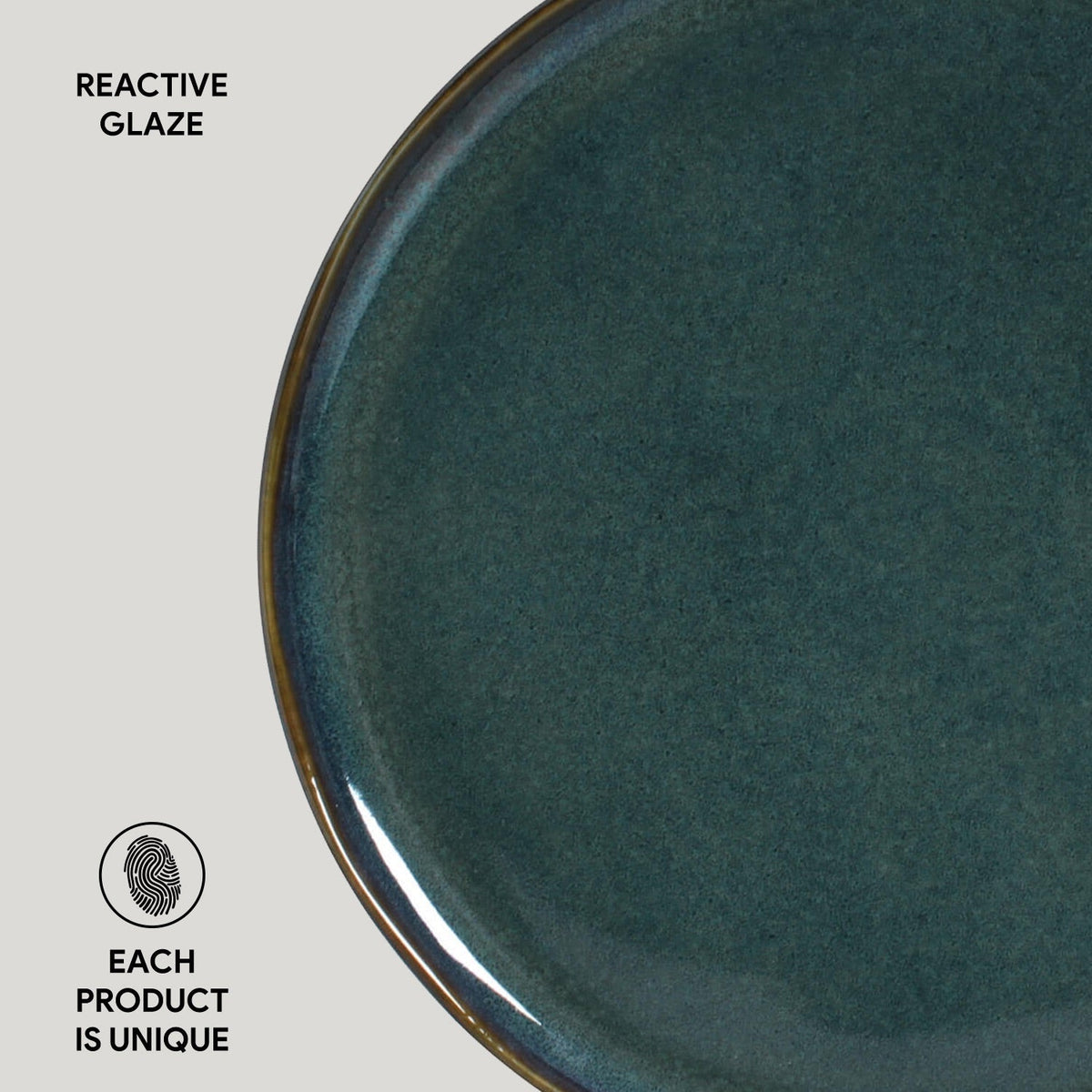 Teal ceramic plate with reactive glaze on a light gray background