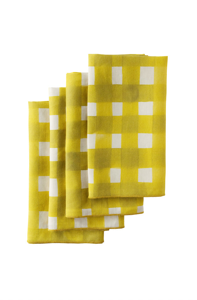 Set of yellow checkered napkins on a white background