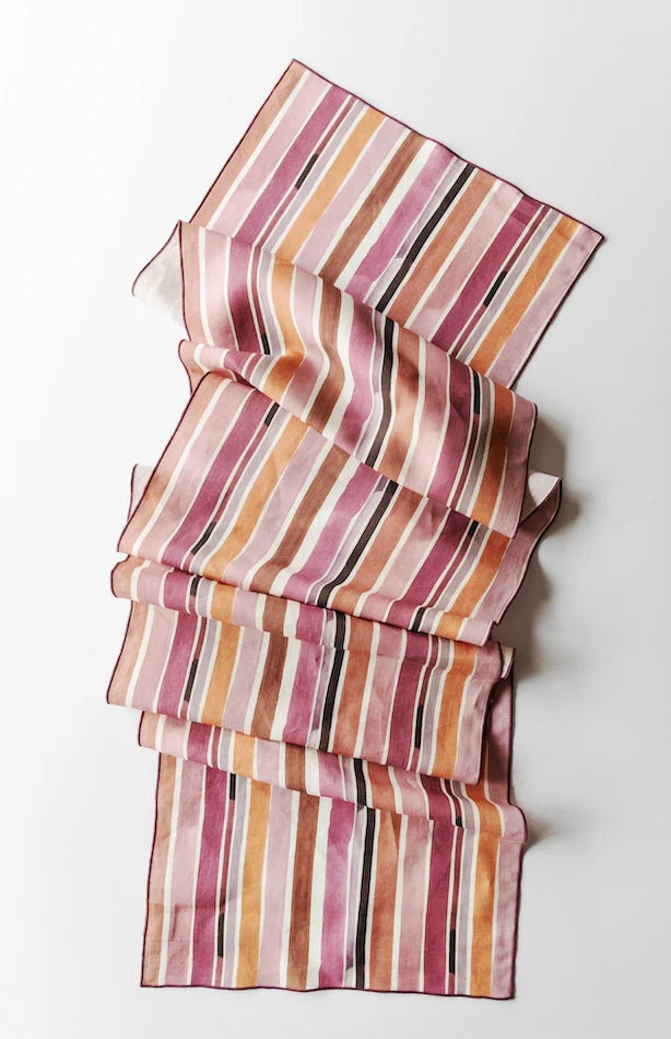 Stack of striped fabric pieces on a white background