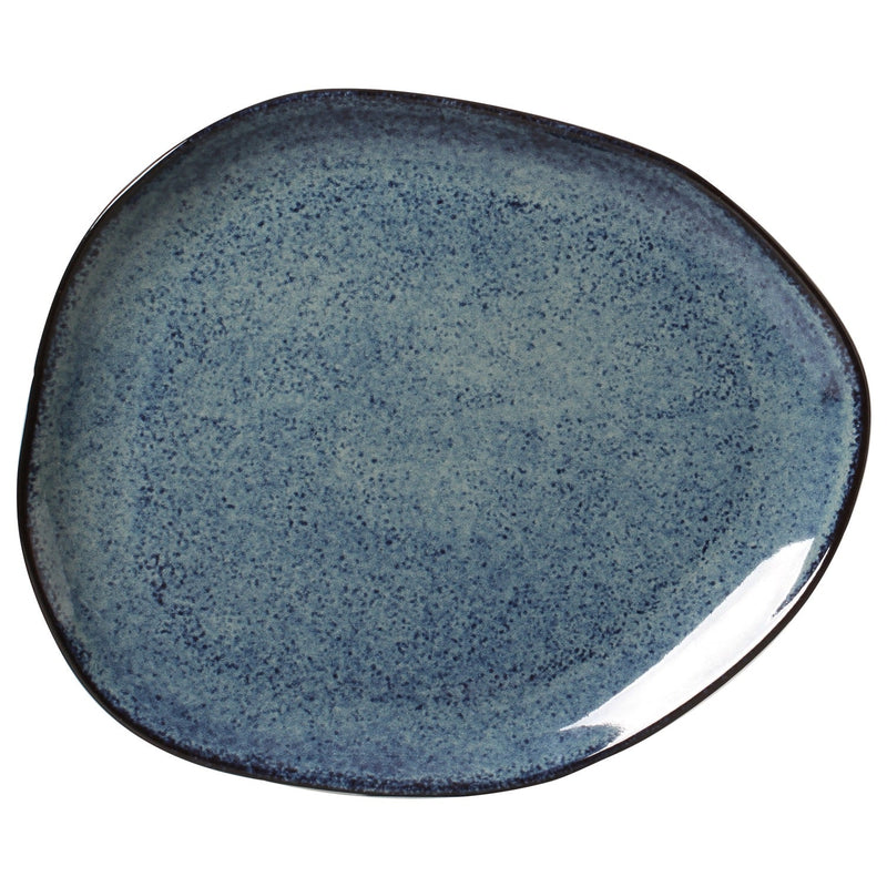 Blue ceramic plate with speckled texture on a white background