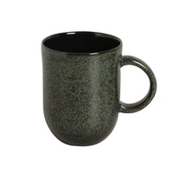 Green speckled mug on a white background
