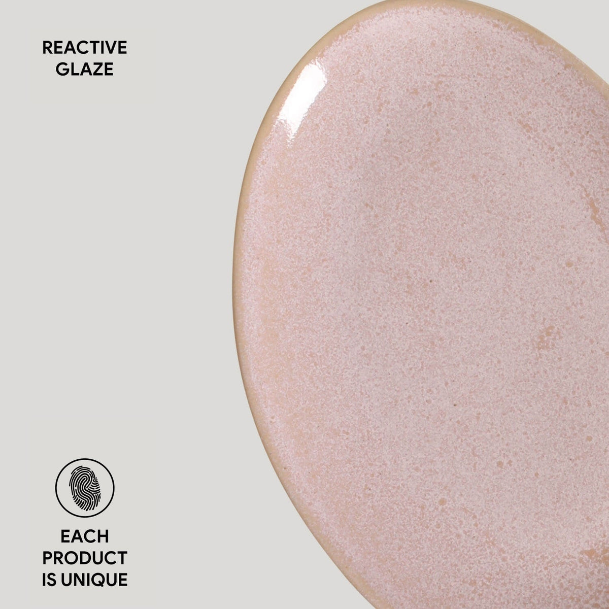 Close-up of a ceramic product with reactive glaze on a light gray background