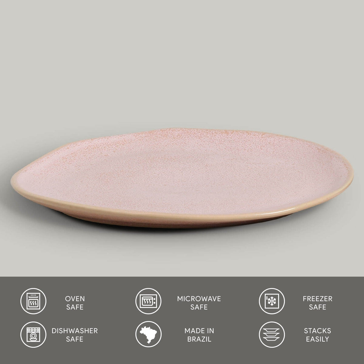 Pink ceramic plate on a gray background with safety and feature icons at the bottom.