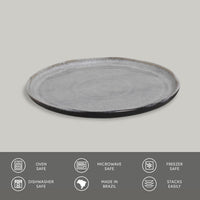 Round gray ceramic plate on a light gray background with safety and feature icons at the bottom.