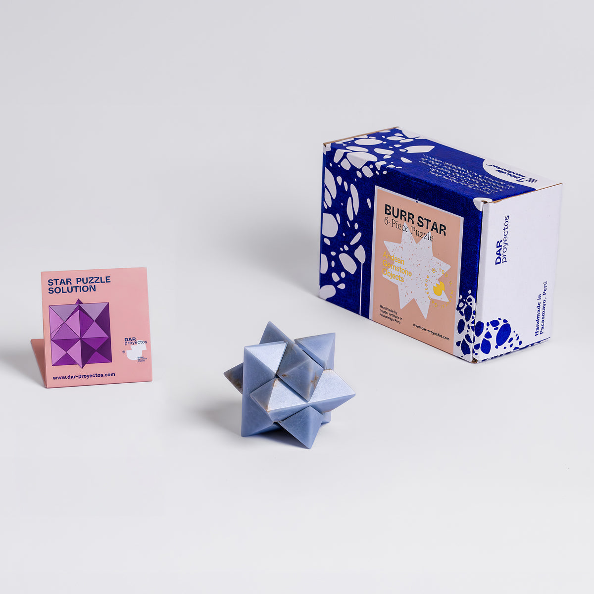 Burr Star puzzle with packaging on a white background