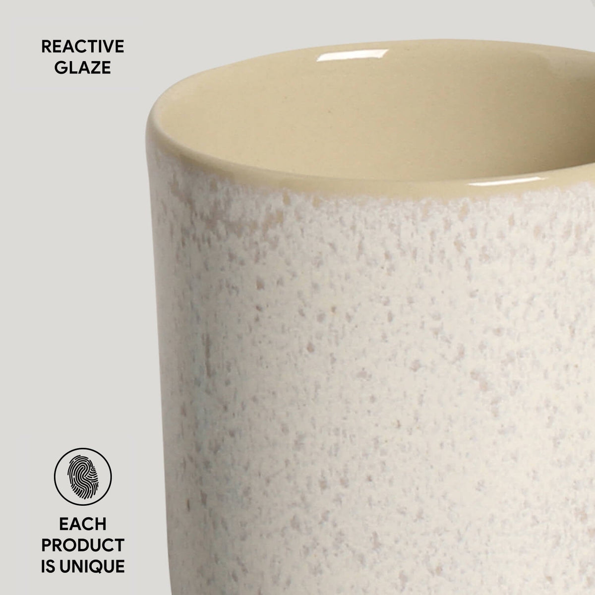 Ceramic vase with reactive glaze finish on a light gray background