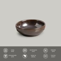 Metallic ceramic bowl on a gray background with safety and feature icons at the bottom.