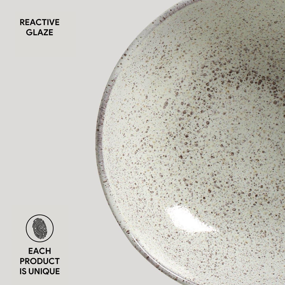 Ceramic plate with reactive glaze on a light gray background