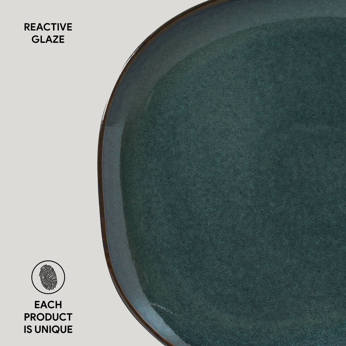 Ceramic plate with reactive glaze on a light gray background