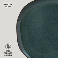 Ceramic plate with reactive glaze on a light gray background