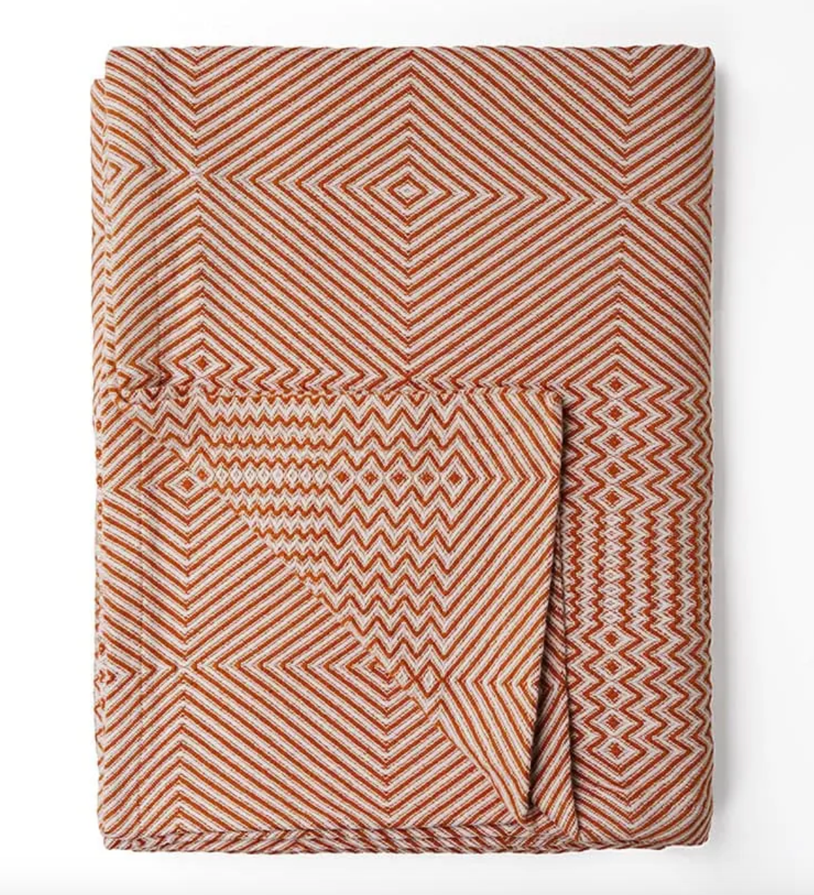 Folded fabric with geometric pattern on a white background