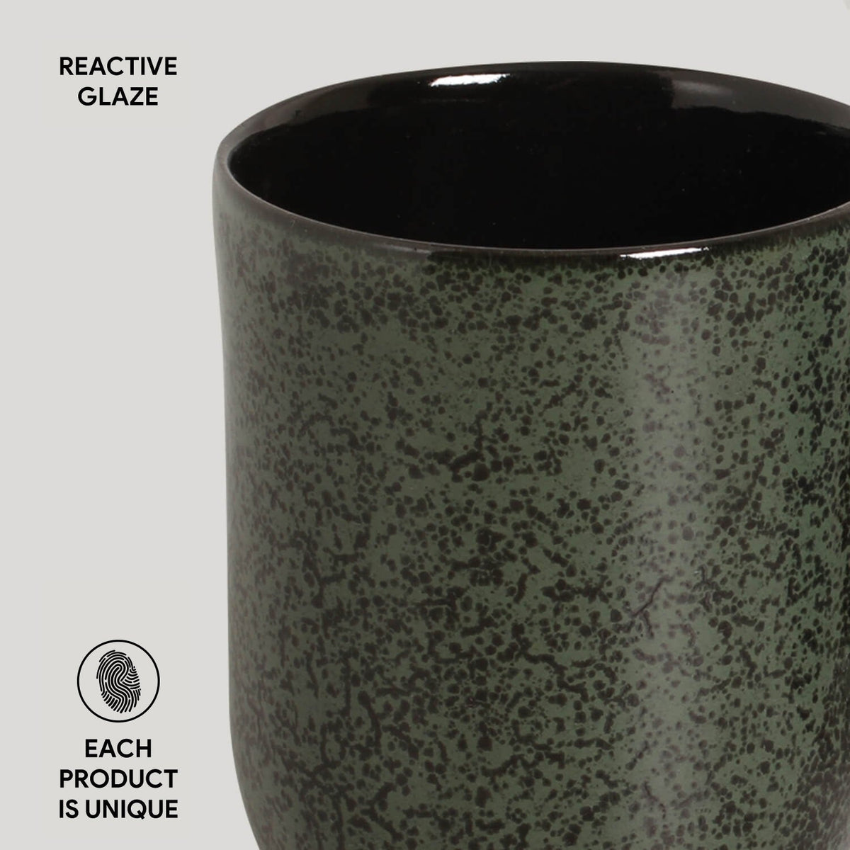 Ceramic mug with reactive glaze finish on a light gray background