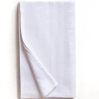 White textured bath towel folded