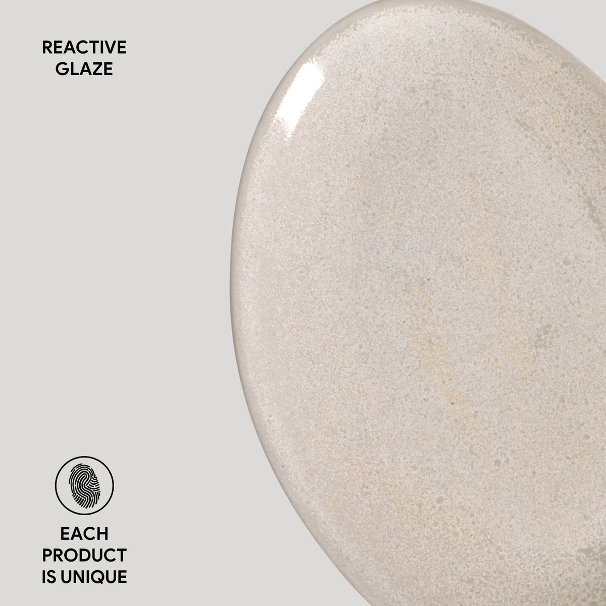 Close-up of a ceramic product with reactive glaze on a gray background