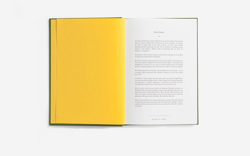 Open book with a yellow page on a white background