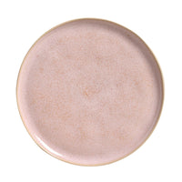 Round ceramic plate with a textured surface on a white background